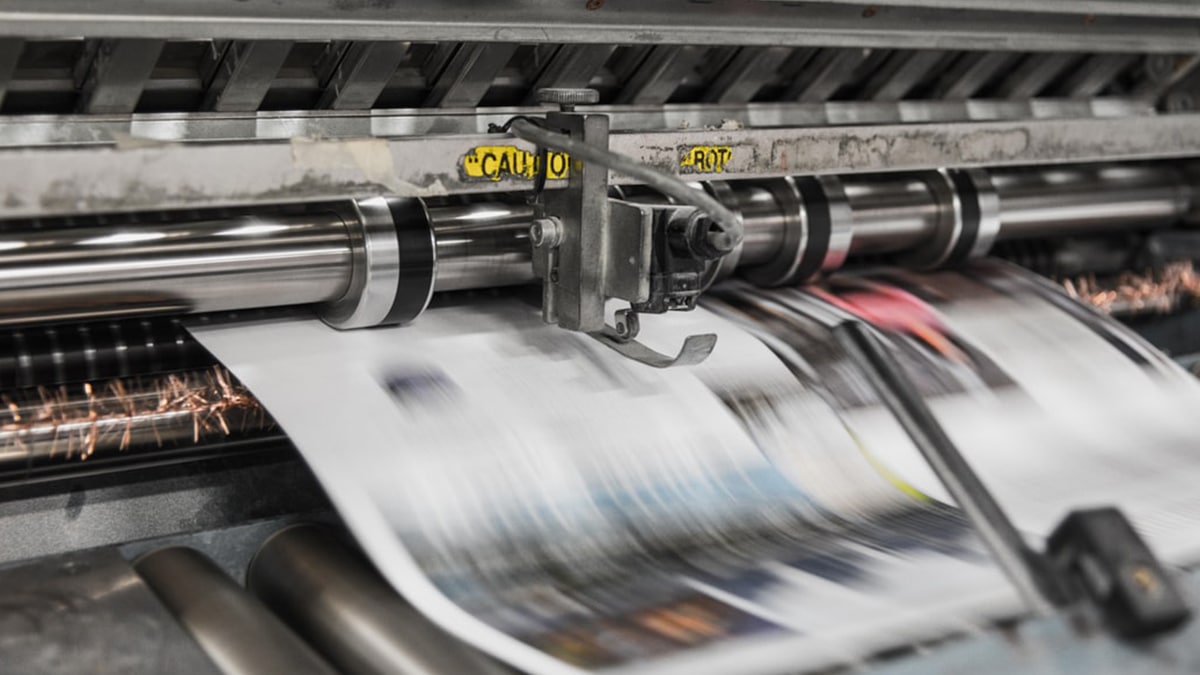 Commercial printing press with a print run to illustrate Mackman Research's work with Archant