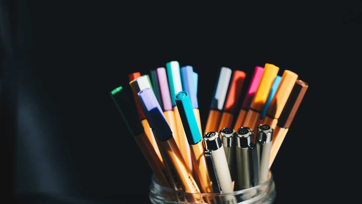 Pot of assorted coloured pens to illustrate Mackman Research's work with Herts FullStop