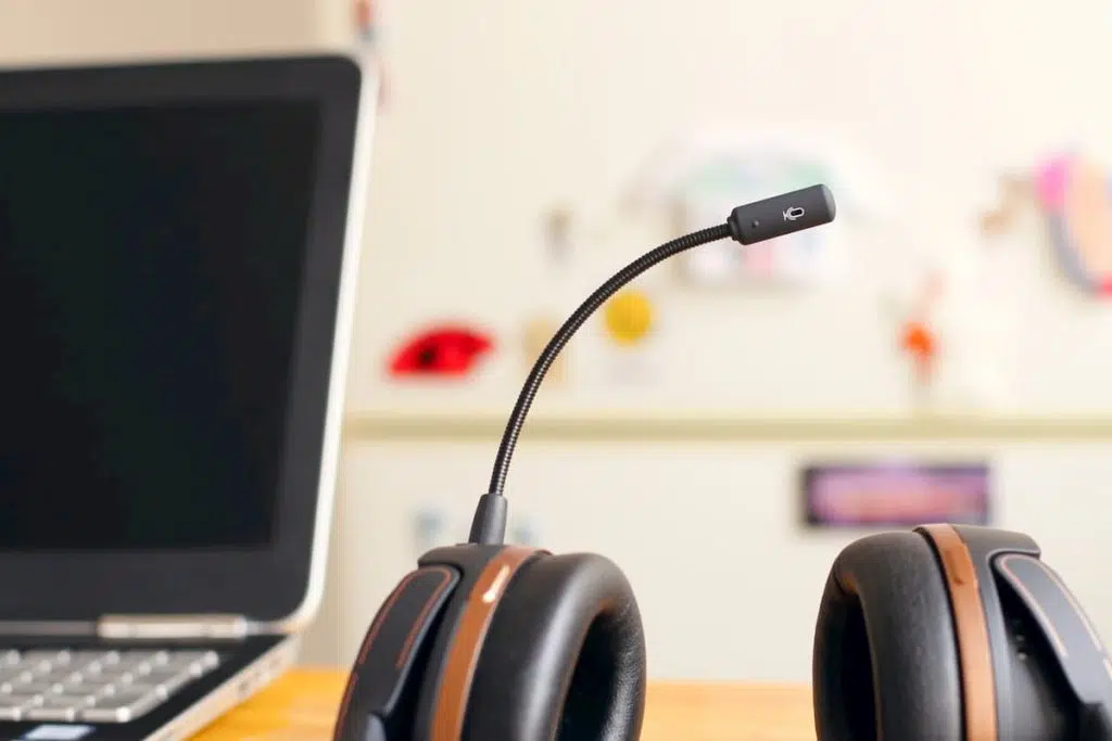 Clear Thinking IT Solutions - Customer Satisfaction Survey 2 Headset with microphone next to open laptop in an office