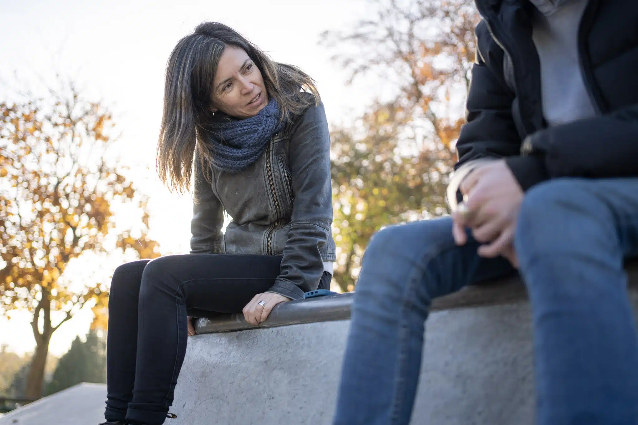 Interviewer speaks with Gen Z research participant in skate park
