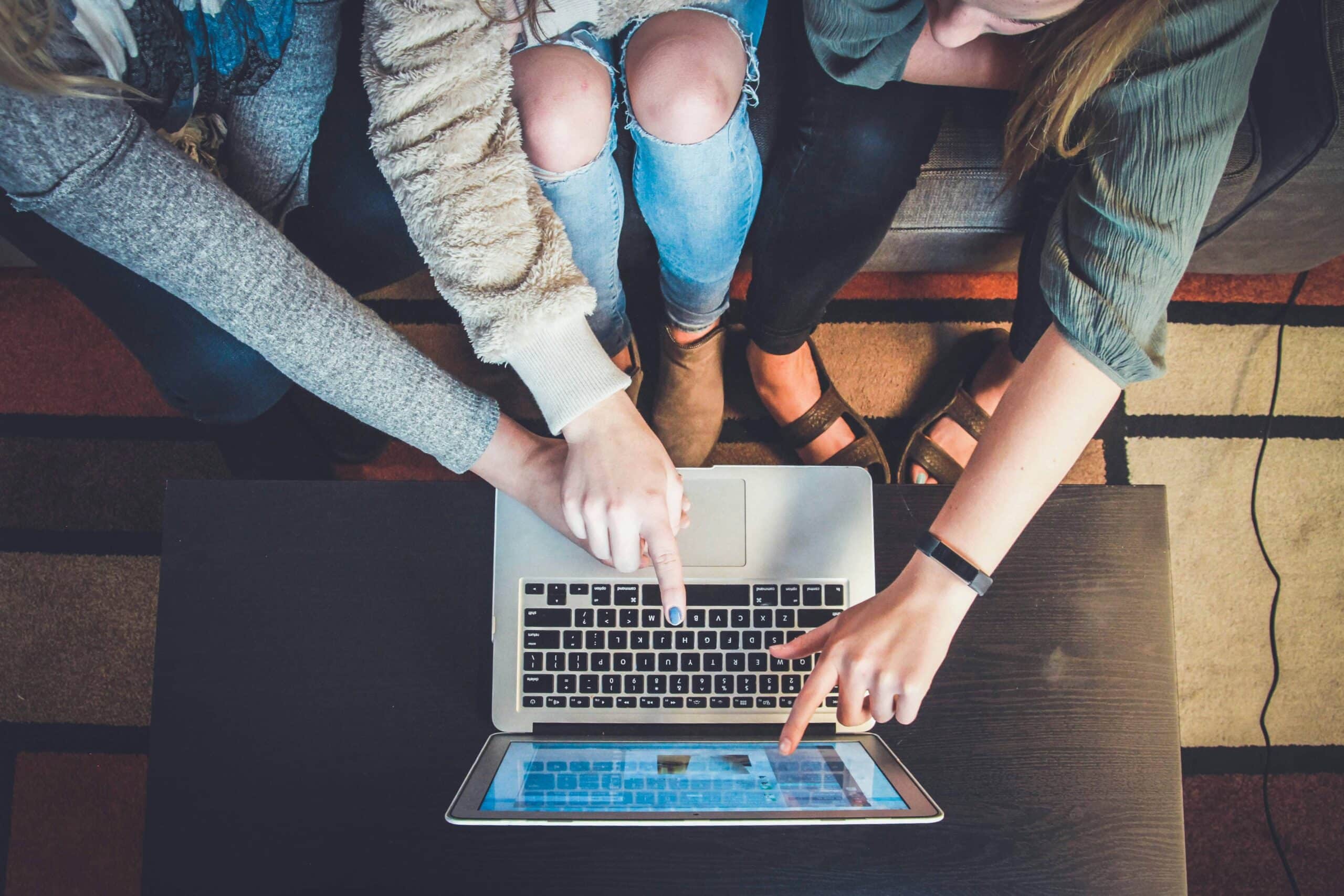 cultural sensitivity in marketing | Group of people from mixed cultures completing market research survey online.